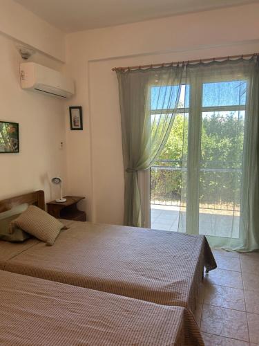Ένα ή περισσότερα κρεβάτια σε δωμάτιο στο Villa Pelops Petalidi