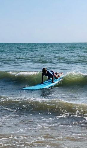 a person riding a wave on a surfboard in the ocean at Annonce supprimée in Dolus d'Oléron