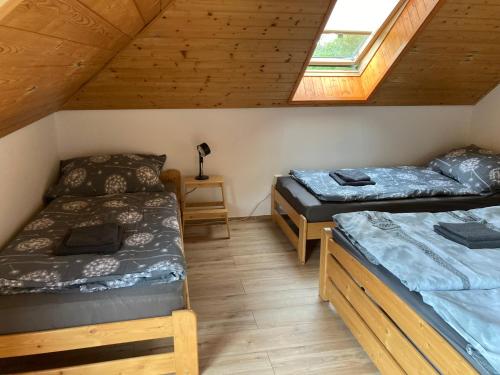 Postel nebo postele na pokoji v ubytování Penzion Kunčice