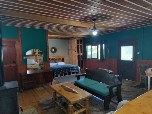 a room with a bed and a couch and a table at Studio Katerina in Florina