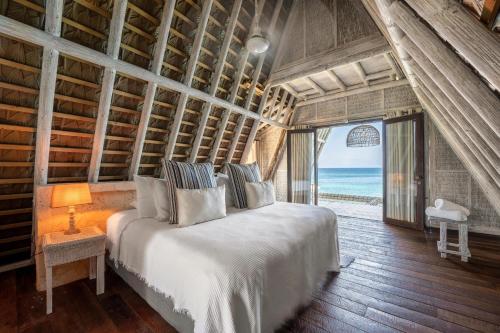 Letto o letti in una camera di Isla Matamba