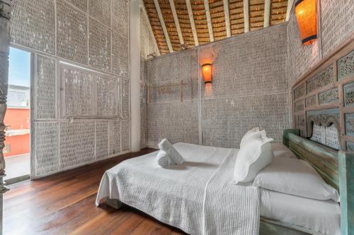 Letto o letti in una camera di Isla Matamba