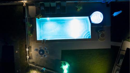 an overhead view of a swimming pool at night at Zeus Sea View Villa with Private Pool, Afytos in Afitos