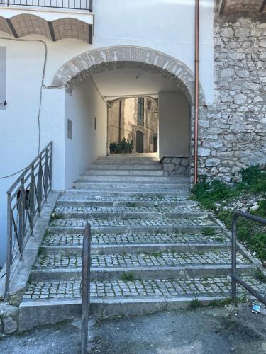 an entrance to a building with stone stairs at Short let SanRocco in Olevano Romano