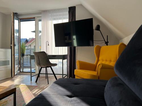 Televisyen dan/atau pusat hiburan di Comfort Apartments Palanga