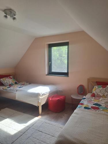 Postel nebo postele na pokoji v ubytování SzigligetM51 Vendégház