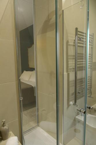 a shower with a glass door in a bathroom at B&B Sbarco dei 1000 Marsala in Marsala