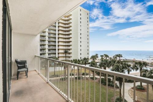 a balcony with a view of a building and the ocean at Seaside Beach 5415- direct beach front pools sauna in Orange Beach