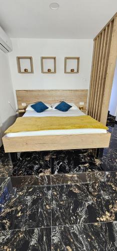 a bedroom with a bed in a room at Studio Kamarin in Buzdohanj