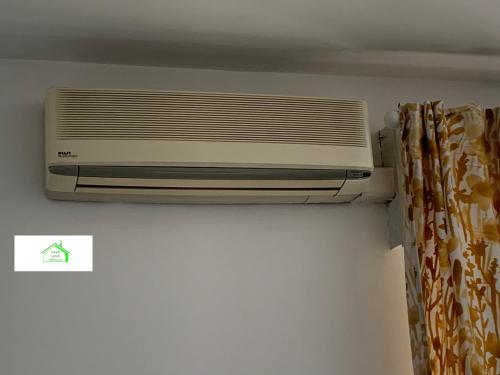 a air conditioner on a wall in a room at Casa Lavi Rapallo in Rapallo