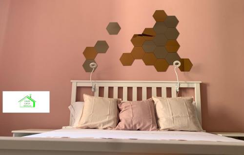 a bedroom with a bed with a hexagonal wall at Casa Lavi Rapallo in Rapallo