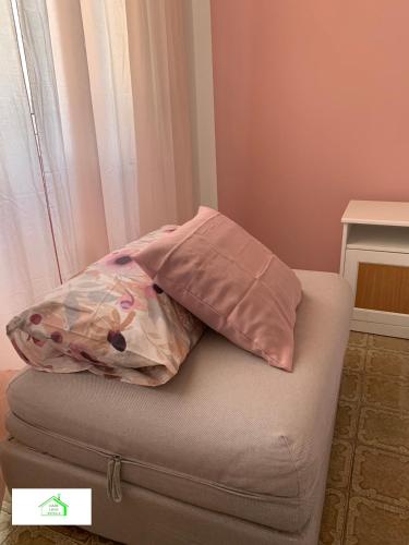 a pillow sitting on top of a couch at Casa Lavi Rapallo in Rapallo