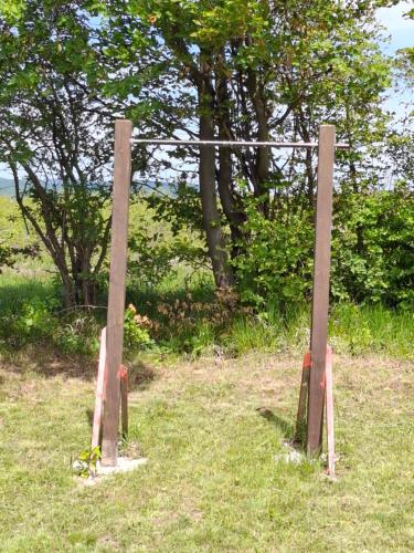 a wooden fence in the middle of a field at Apartmani Feliks in Resavica