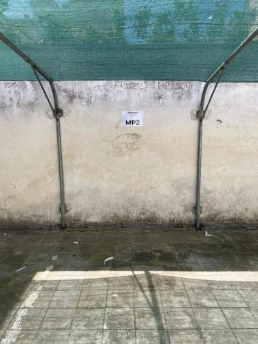 a wall with a sign on the side of it at Maison Patricia in Lecce
