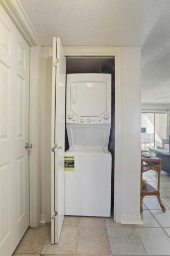 a white refrigerator with a microwave in a room at Seaside Beach 2103- Ground level beachside in Orange Beach