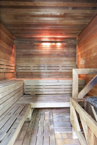 an empty sauna with wooden walls and wooden floors at Seaside Beach 2103- Ground level beachside in Orange Beach
