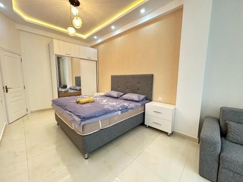 A bed or beds in a room at Whitestone Residence 74