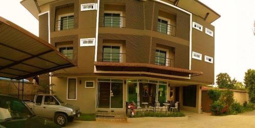 a house with a car parked in front of it at Bansappoori in Lamphun