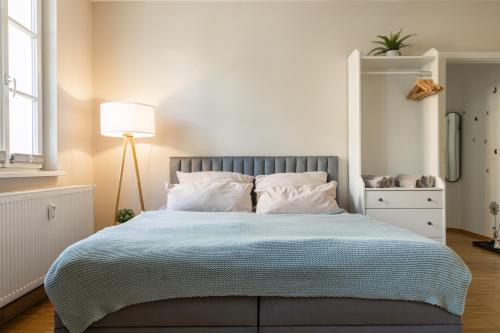 En eller flere senge i et værelse på Ein gemütliches Studio mit Netflix im Zentrum Bahnhofsnähe