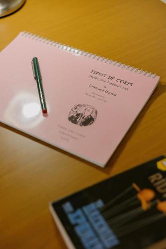 a pen sitting on top of a notebook on a desk at Catherine's View in Agios Rokkos
