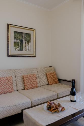 a living room with a couch and a table at Catherine's View in Agios Rokkos