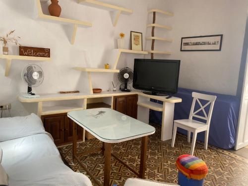 Televízia a/alebo spoločenská miestnosť v ubytovaní Casita en el centro
