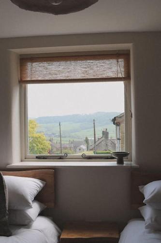 a window in a bedroom with a view at Stock Barn in Youlgreave