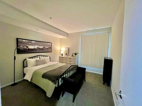 a bedroom with a large bed and a window at Shared House Hollywood Hideaway Heart of Fame in Los Angeles