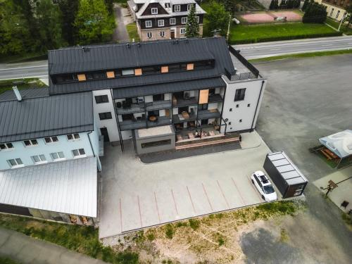 an aerial view of a house with a garage at Luxusní Apartmán Domovjanka - SKALKA FAMILY in Bílá