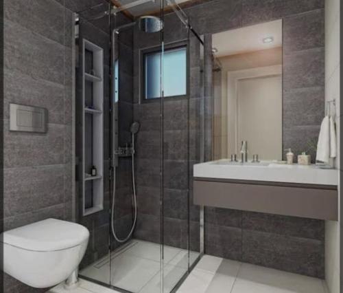 a bathroom with a shower and a toilet and a sink at Miracle HYLen Hotel in Istanbul