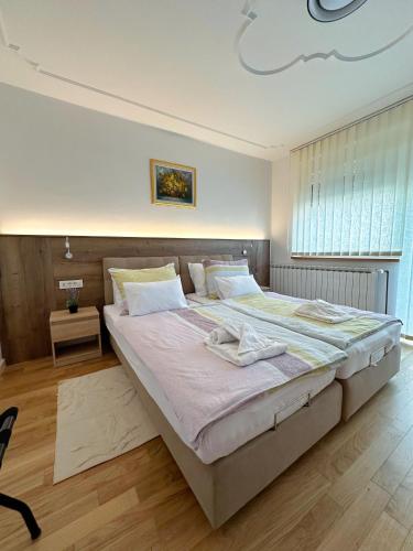 a bedroom with a large bed in a room at Holiday Home Crux in Krizanec