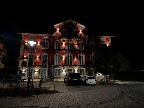 a large red and white building with christmas lights on it at BeeFree WhirlpoolSuiteXL33-FreeParking-FastWiFi in Passau