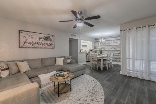 a living room with a couch and a table at Cozy 2BR Farmhouse Apt - Sleeps 8 - FREE Parking! in Arlington