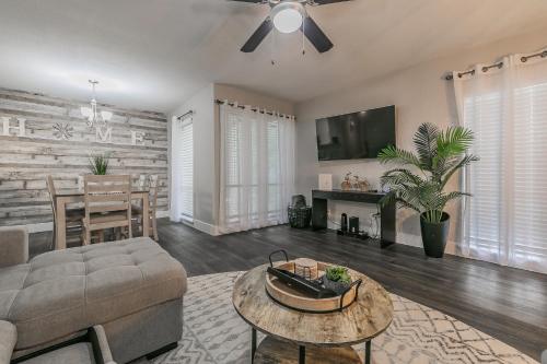 a living room with a couch and a table at Cozy 2BR Farmhouse Apt - Sleeps 8 - FREE Parking! in Arlington