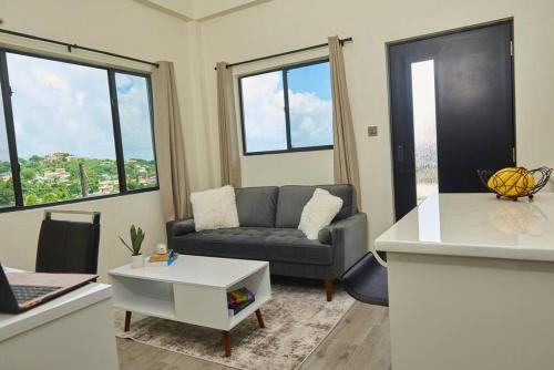 a living room with a couch and a table at Azora Heights in Arnos Vale