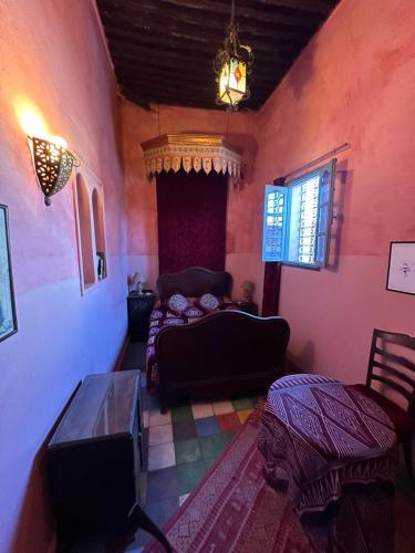 a living room with a couch and a table at La Maison Haute Larache Morocco in Larache