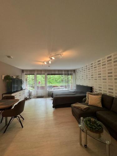 a living room with a couch and a table at Ferienwohnung Lia in Altenau