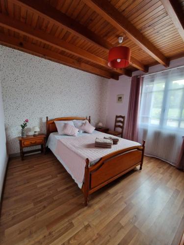 Llit o llits en una habitació de Maison du Coucou