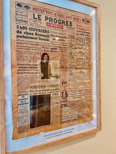 a newspaper article in a frame on a wall at Le Cocon Forézien - RDC - Proche gare et centre - Wifi in Feurs