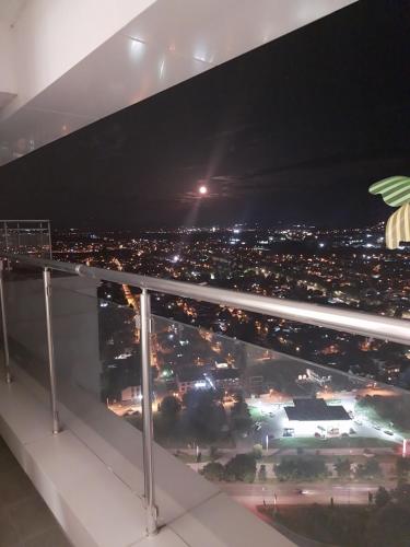 a view of a city at night from a balcony at 33 floor, luxury apartment, amazing view Sky City Cevahir-Skopje in Skopje