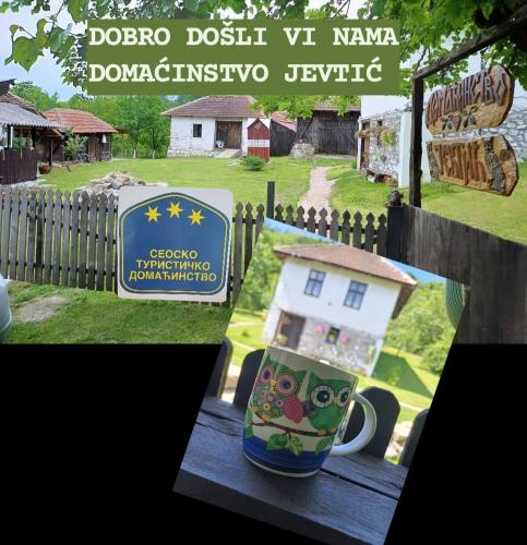 a coffee mug sitting on a table with a house at Seosko Domaćinstvo Jevtić in Ždraljica