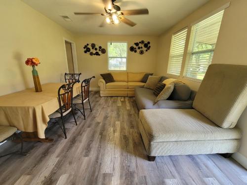 a living room with a couch and a table at Sweet home Alabama! in Mobile