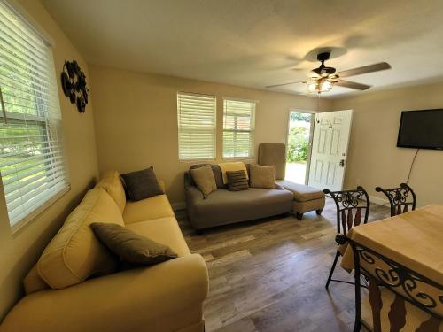 a living room with a couch and a table at Sweet home Alabama! in Mobile