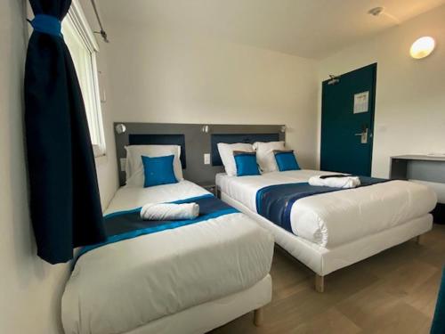 Una cama o camas en una habitación de Fasthotel - Soissons Nord