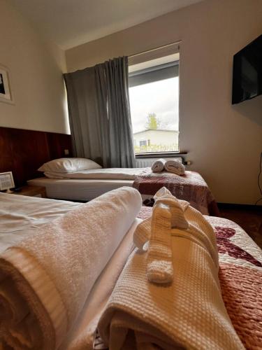 Postel nebo postele na pokoji v ubytování Hotel Skógá by EJ Hotels