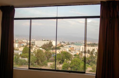 a large window with a view of a city at Soul Garden Hotel in Arequipa