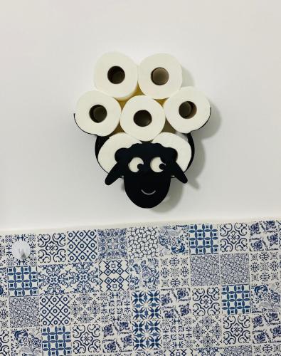 a group of rolls of toilet paper on a wall at Napoli Centro Casa Vacanza in Naples