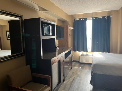 Ένα ή περισσότερα κρεβάτια σε δωμάτιο στο Americas Best Value Inn Kalispell