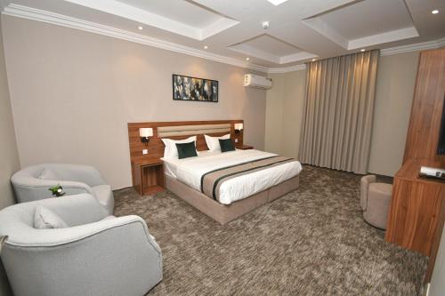 Posteľ alebo postele v izbe v ubytovaní برج الفخامة للاجنحه الفندقيه
