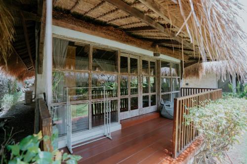 an outside view of a house with a porch at Le Yanandra Bali Resort in Jimbaran